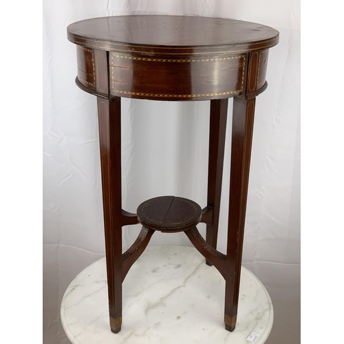 765 - AN ANTIQUE CIRCULAR TABLE WITH INLAID SHELL TO TOP