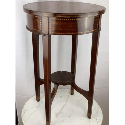 765 - AN ANTIQUE CIRCULAR TABLE WITH INLAID SHELL TO TOP