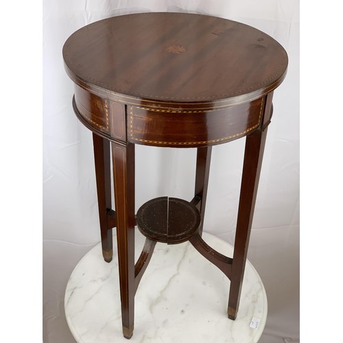 765 - AN ANTIQUE CIRCULAR TABLE WITH INLAID SHELL TO TOP