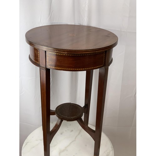 765 - AN ANTIQUE CIRCULAR TABLE WITH INLAID SHELL TO TOP