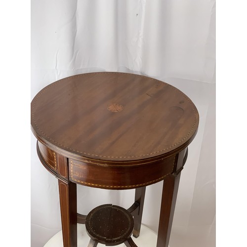 765 - AN ANTIQUE CIRCULAR TABLE WITH INLAID SHELL TO TOP