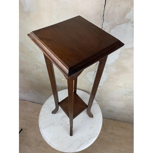 22 - A MAHOGANY PLANTSTAND