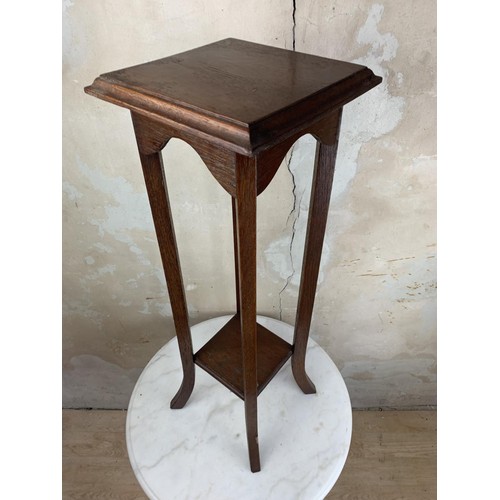 22 - A MAHOGANY PLANTSTAND