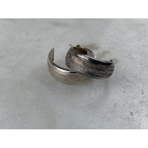 200 - A PAIR OF SILVER HALF HOOP EARRINGS