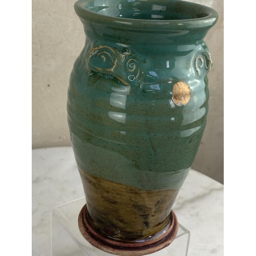 92 - A GLAZED POTTERY VASE 8