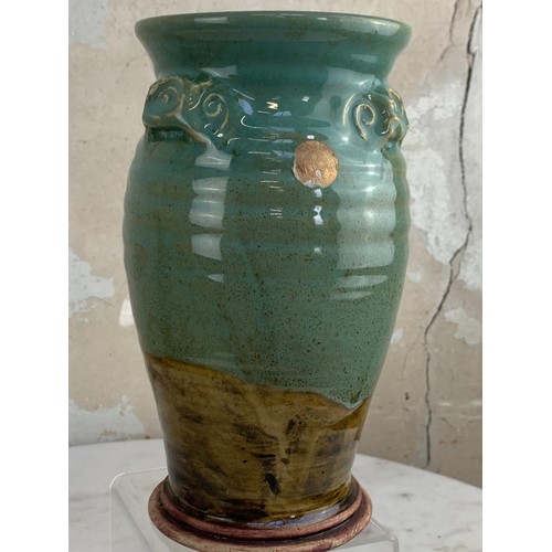 92 - A GLAZED POTTERY VASE 8