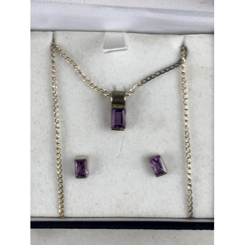 228 - A BOXED SILVER AND AMETHYST NECKLACE AND MATCHING EARRINGS