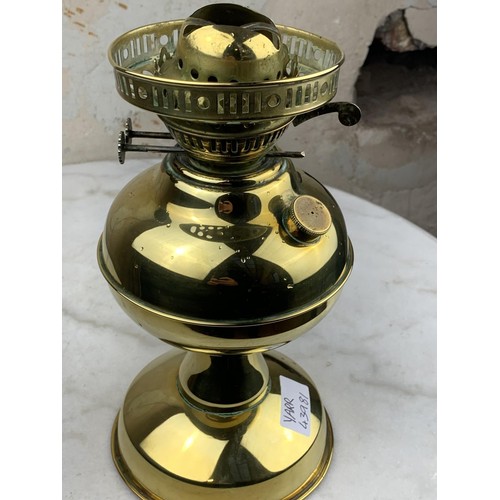 129 - A BRASS OIL LAMP