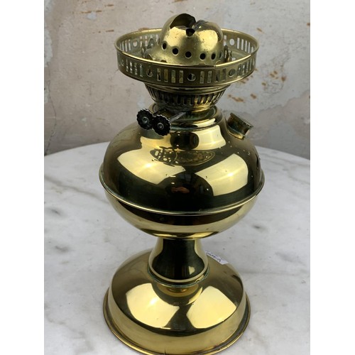 129 - A BRASS OIL LAMP