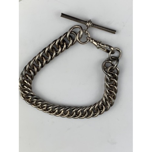 237 - A HEAVY SILVER CURB LINK WRIST CHAIN WITH T BAR