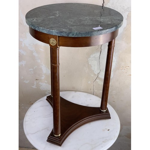 132 - A CIRCULAR MARBLE TOP TABLE