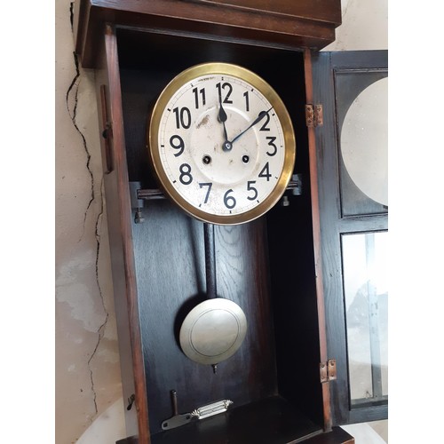 134 - GERMAN WALL CLOCK WITH PEND AND KEY