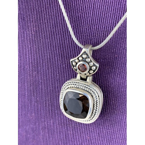 241 - A SILVER AND AMETHYST PENDANT ON SILVER CHAIN