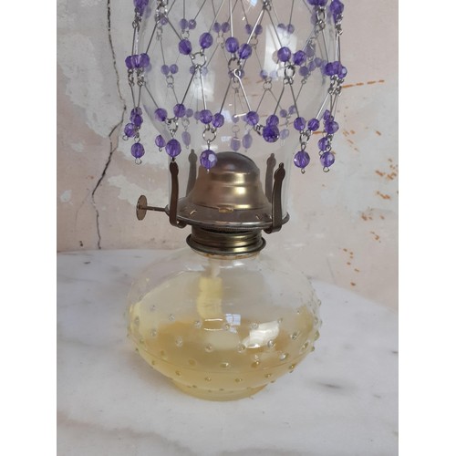 144 - 2 GLASS OIL LAMPS