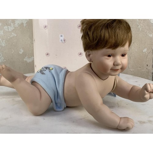 147 - A PORCELAIN BABY DOLL 17