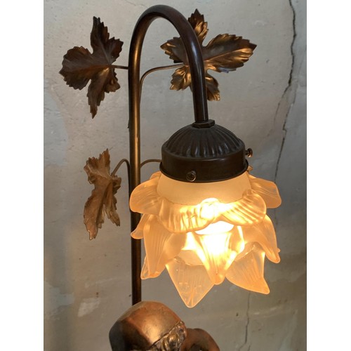 157 - A BRONZED FINISH FIGURENE LAMP WITH A TULIP SHADE