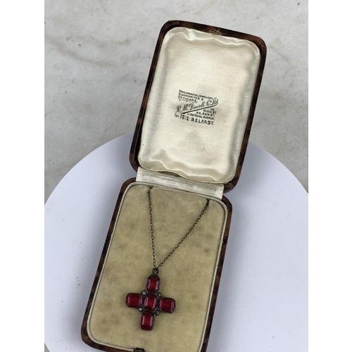 257 - 800 HALLMARKED SILVER SET RUBY CROSS WITH CORNER SET CRYSTALS ON MATCHING CHAIN