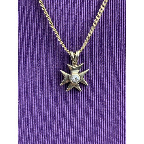 265 - AN 18K MALTESE CROSS SET WITH SINGLE DIAMOND ON A ROLLED GOLD CHAIN