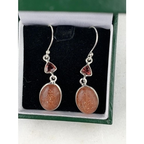 283 - A PAIR OF SILVER TOPAZ AND DROP EARRINGS