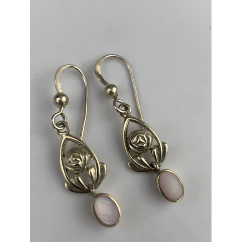 294 - A PAIR OF SILVER AND M.O.P EARRINGS IN McINTOSH STYLE