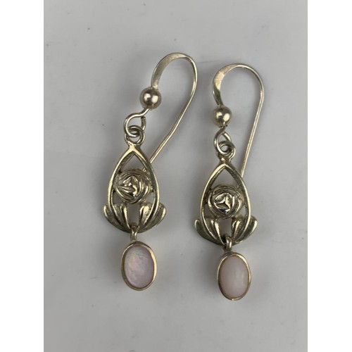 294 - A PAIR OF SILVER AND M.O.P EARRINGS IN McINTOSH STYLE