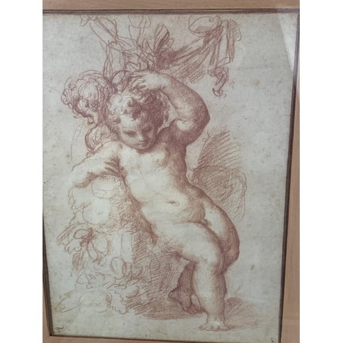 45 - AN ORNATE FRAMED PRINT OF A CHERUB & AN USUAL GILT FRAMED PRINT