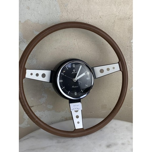 311 - A STEERING WHEEL CLOCK 14