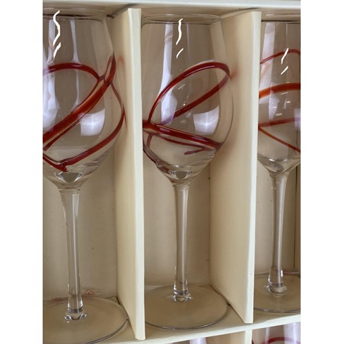 313 - A SET OF 6 FESTIVE KILKENNY WINE GLASSES IN ORIGIAL BOX