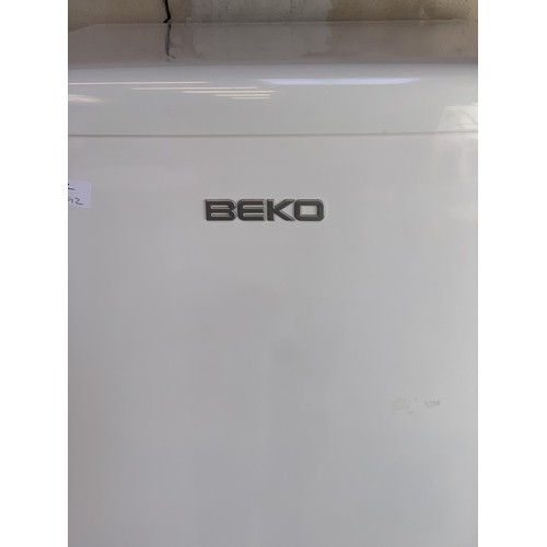 131 - A BEKO FRIDGE FREEZER PWO