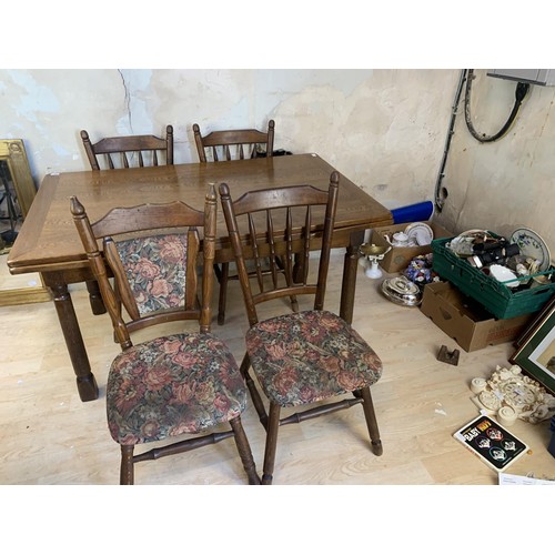 168 - AN OAK DRAW LEAF TABLE AND 6 CHAIRS