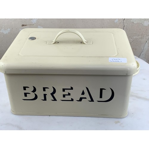 407 - AN ENAMEL BREADBIN AND 3 CUPS