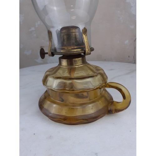 167 - AMBER GLASS FINGER LAMP AND CHIMMINEY