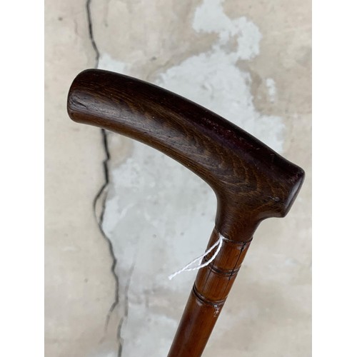 390 - A VINTAGE OAK WALKING STICK