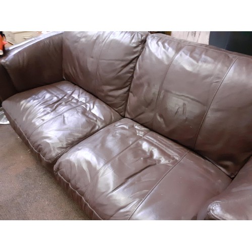 405 - A BROWN LEATHER CURVED ARMED SOFA