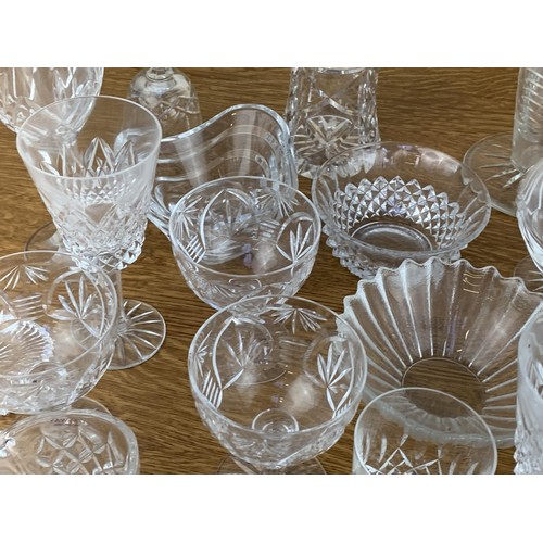 399 - A TABLE LOT OFCRYSTAL INCLUDING  WATERFORD AND TYRONE CRYSTAL