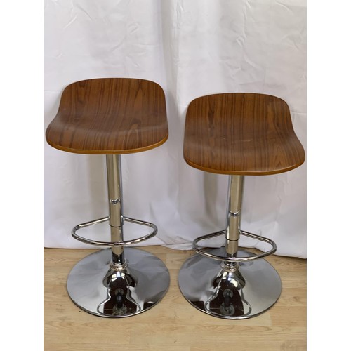 403 - A PAIR OF WALNUT AND CHROME BAR STOOLS