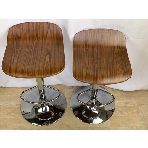 403 - A PAIR OF WALNUT AND CHROME BAR STOOLS