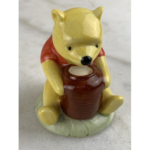 453 - A ROYAL DOULTON FIGURE WINNIE THE POOH AND THE HONEY POT