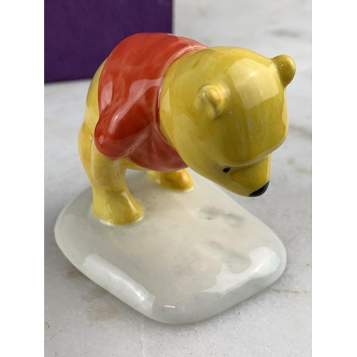 459 - A ROYAL DOULTON FIGURE WINNIE THE POOH AND THE PAW MARKS