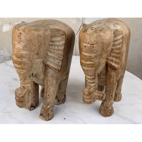 492 - A PAIR OF WOODEN ELEPHANTS