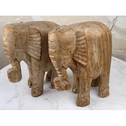 492 - A PAIR OF WOODEN ELEPHANTS