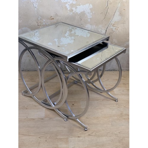 527 - A NEW SET OF CHROME & MIRRORED NEST OF TABLES