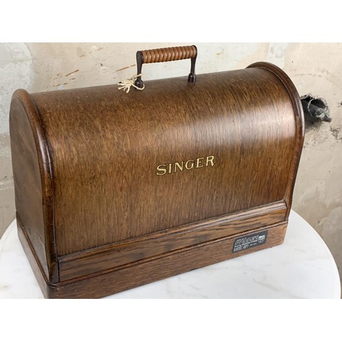 544 - AN OLD CASED (WITH KEY) SINGER HAND SEWING MACHINE PWO