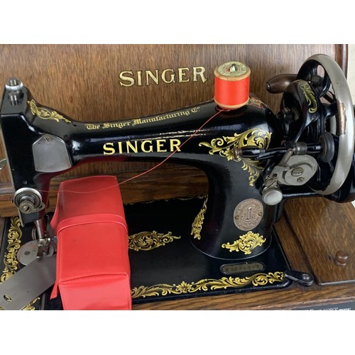 544 - AN OLD CASED (WITH KEY) SINGER HAND SEWING MACHINE PWO