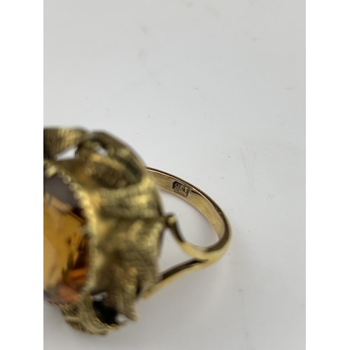 563 - A BRILLIANTLY ORNATE 9ct GOLD RING WITH ORANGE STONE