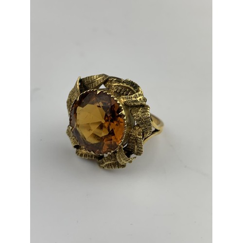 563 - A BRILLIANTLY ORNATE 9ct GOLD RING WITH ORANGE STONE