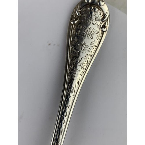 565 - A LONDON SILVER SPOON HEAVILY EMBOSSED WITH FLORAL PATTERN