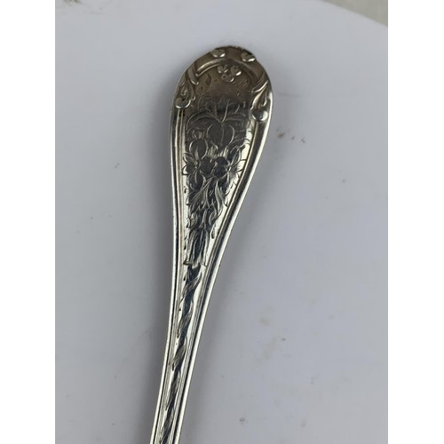 565 - A LONDON SILVER SPOON HEAVILY EMBOSSED WITH FLORAL PATTERN