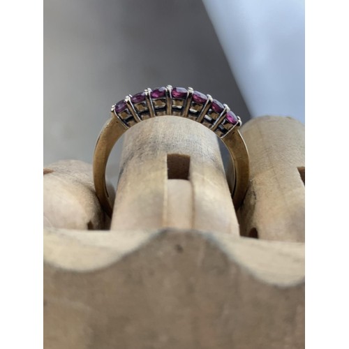 578 - 9ct 7 GARNET RING