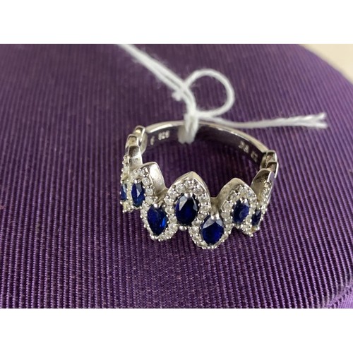 586 - A DESIGNER STYLE CZ SILVER BLUE STONE RING